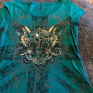 Bella du tour top with pretty design on front.